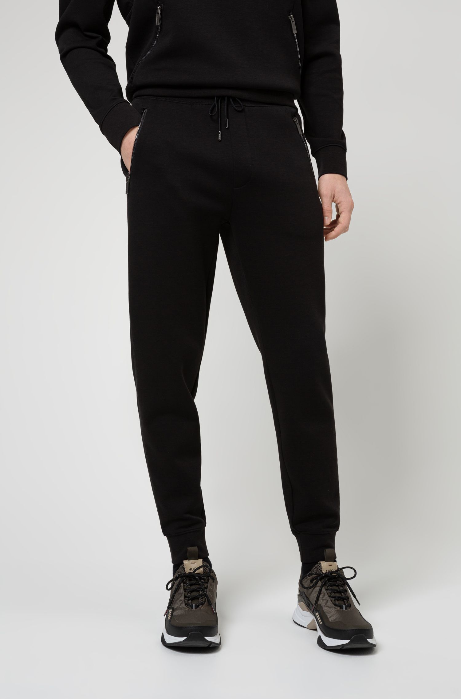 BOSS - Regular-fit tracksuit bottoms with multi-coloured logos